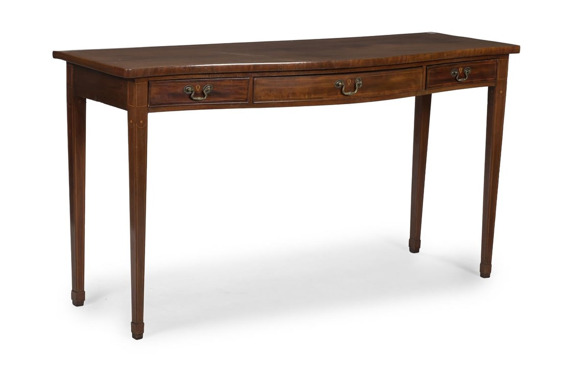 A LATE GEORGE III MAHOGANY SERPENTINE SERVING TABLE, CIRCA 1800: A LATE GEORGE III MAHOGANY SERPENTINE SERVING TABLE CIRCA 1800 The shaped top and conforming frieze with three drawers on square tapering legs 95cm high, 177cm wide, 62cm deep Provenance: