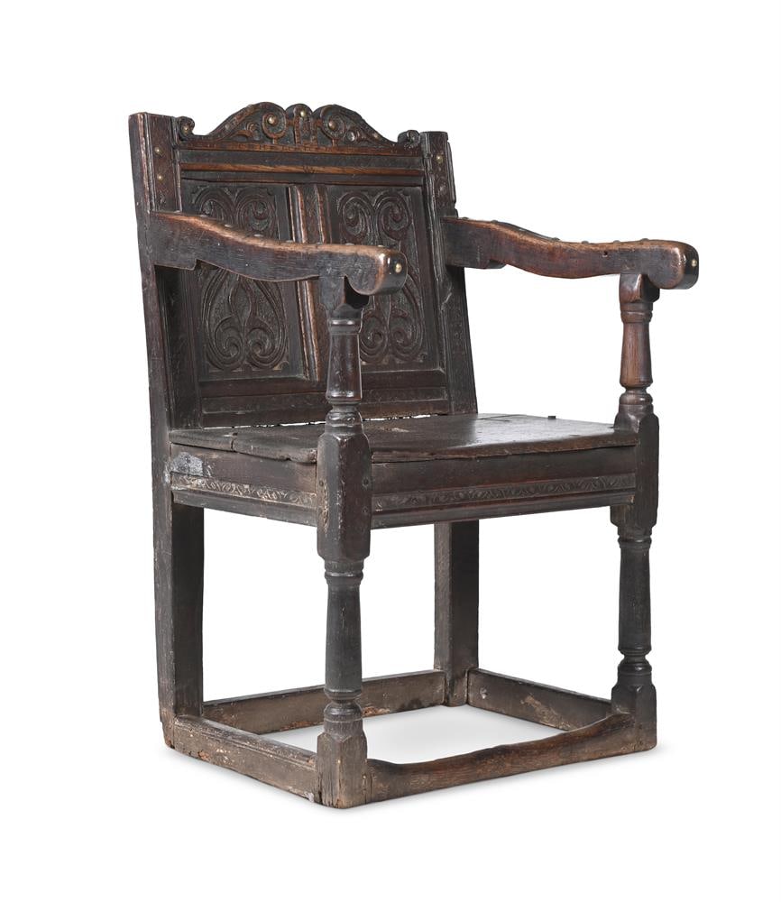 A COMMONWEALTH OAK PANEL BACK ARMCHAIR, CIRCA 1650: A COMMONWEALTH OAK PANEL BACK ARMCHAIR CIRCA 1650 84cm high, 57cm wide, 40cm deep Condition Report: PLEASE NOTE: ALL LOTS ARE LOCATED AT SACKVILLE WEST STORAGE IN ANDOVER (SP10 3SA) AND ARE NOT