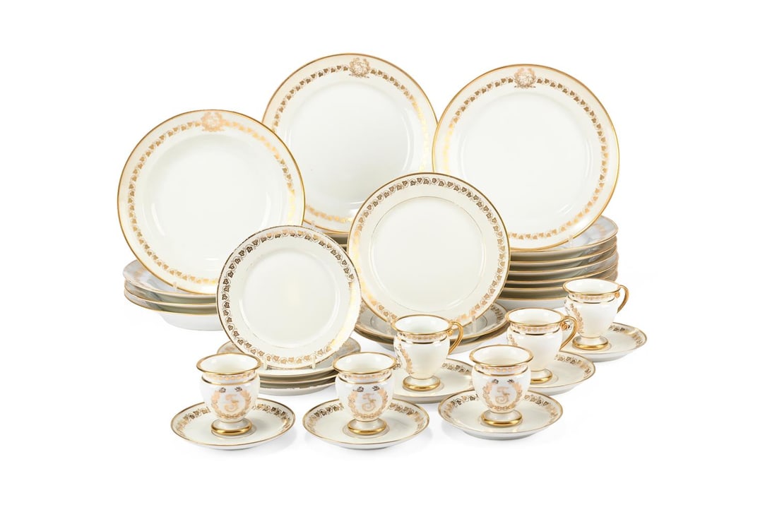 A COMPOSITE PARIS PORCELAIN AND LIMOGES PART DINNER SERVICE, LATE 19TH CENTURY: A COMPOSITE PARIS PORCELAIN AND LIMOGES PART DINNER SERVICE IN NAPOLEON III SEVRES STYLE LATE 19TH CENTURY Gilt with a script 'F' monogram and a border of scrolling vine Comprising four side