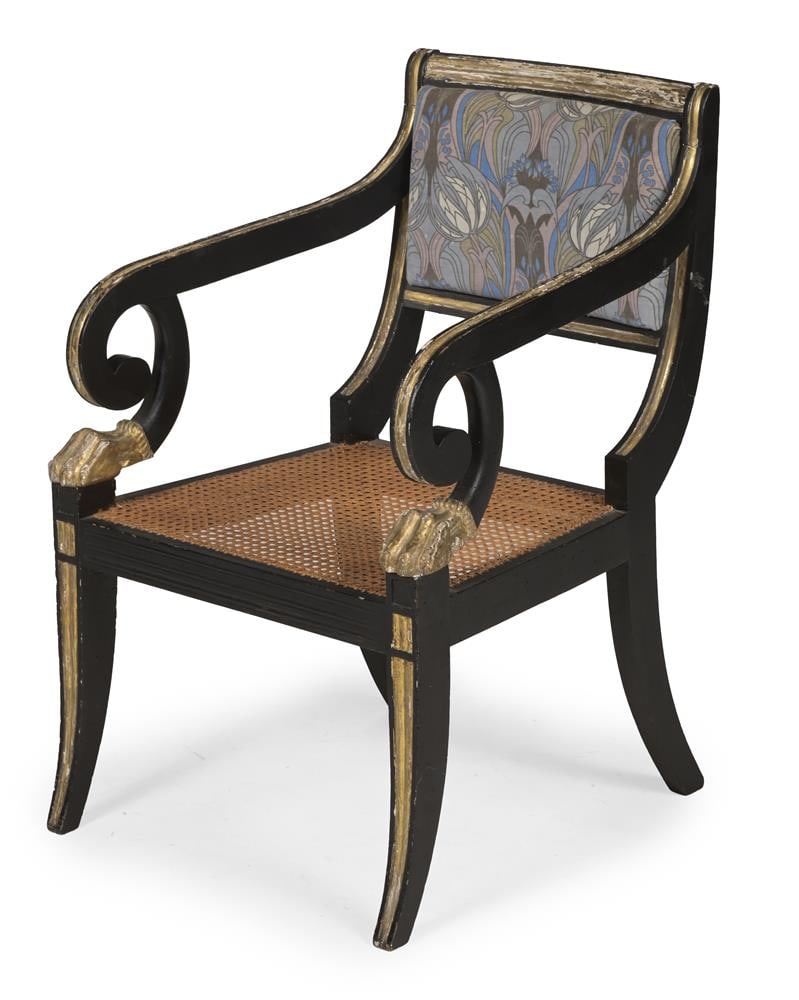 A REGENCY EBONISED AND PARCEL GILT OPEN ARMCHAIR, CIRCA 1820: A REGENCY EBONISED AND PARCEL GILT OPEN ARMCHAIR CIRCA 1820 With carved lion's paw arm supports 84cm high, 59cm wide, 61cm deep Condition Report: PLEASE NOTE: ALL LOTS ARE LOCATED AT SACKVILLE