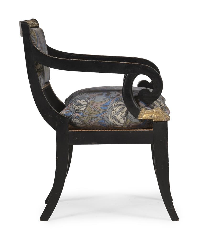 A REGENCY EBONISED AND PARCEL GILT OPEN ARMCHAIR, CIRCA 1820 - 4