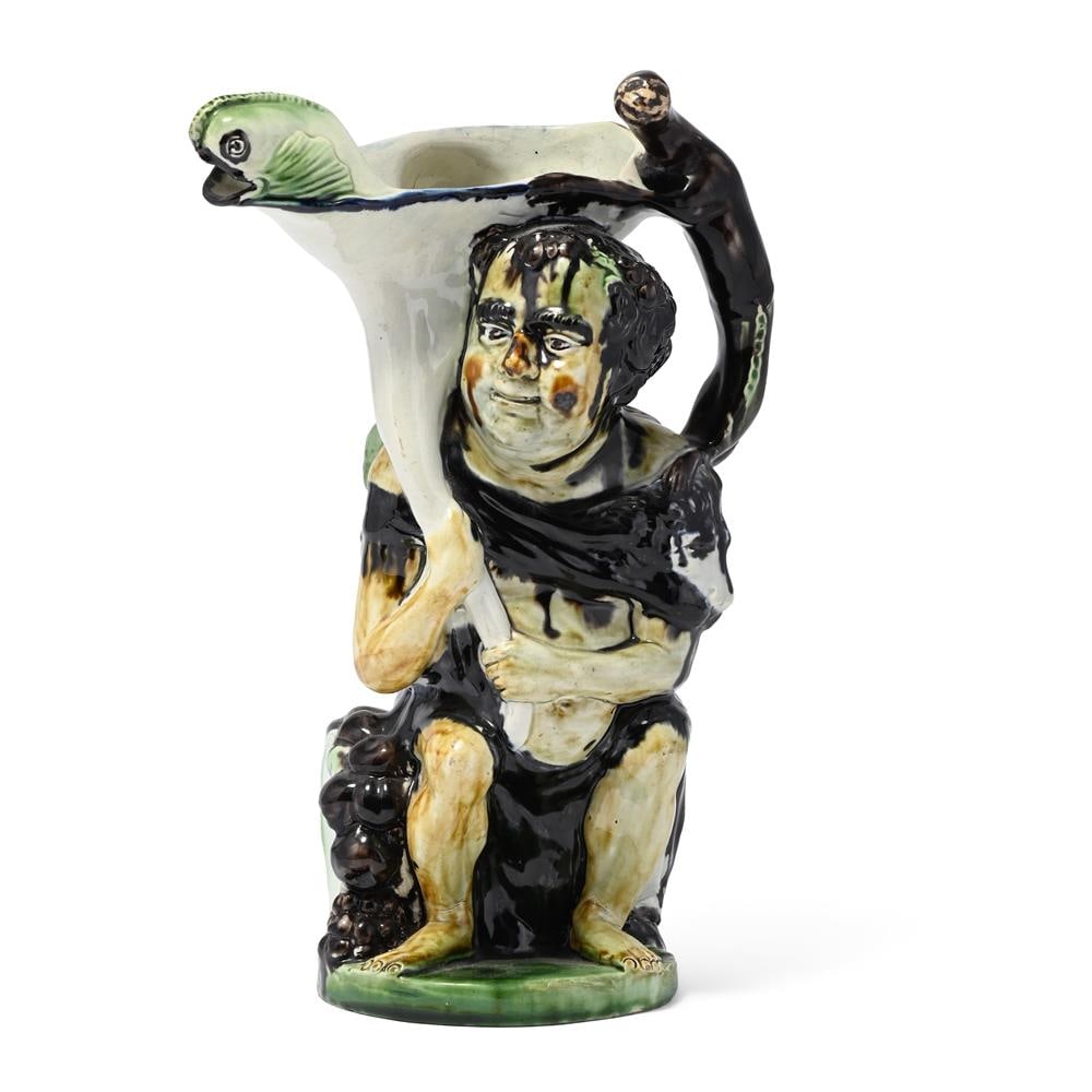 A STAFFORDSHIRE PEARLWARE 'BACCHUS AND PAN' JUG AFTER THE MODEL BY JEAN VOYEZ, CIRCA 1800: A STAFFORDSHIRE PEARLWARE 'BACCHUS AND PAN' JUG AFTER THE MODEL BY
