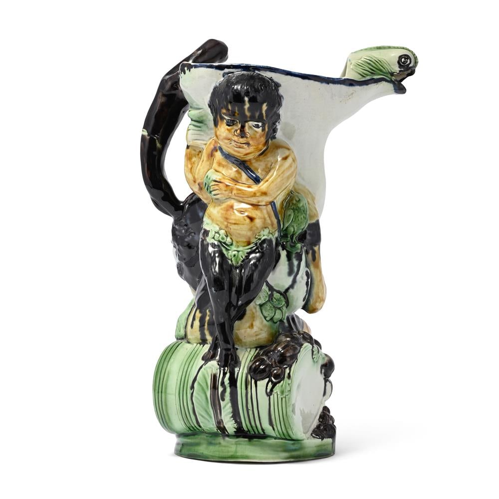 A STAFFORDSHIRE PEARLWARE 'BACCHUS AND PAN' JUG AFTER THE MODEL BY JEAN VOYEZ, CIRCA 1800 - 2