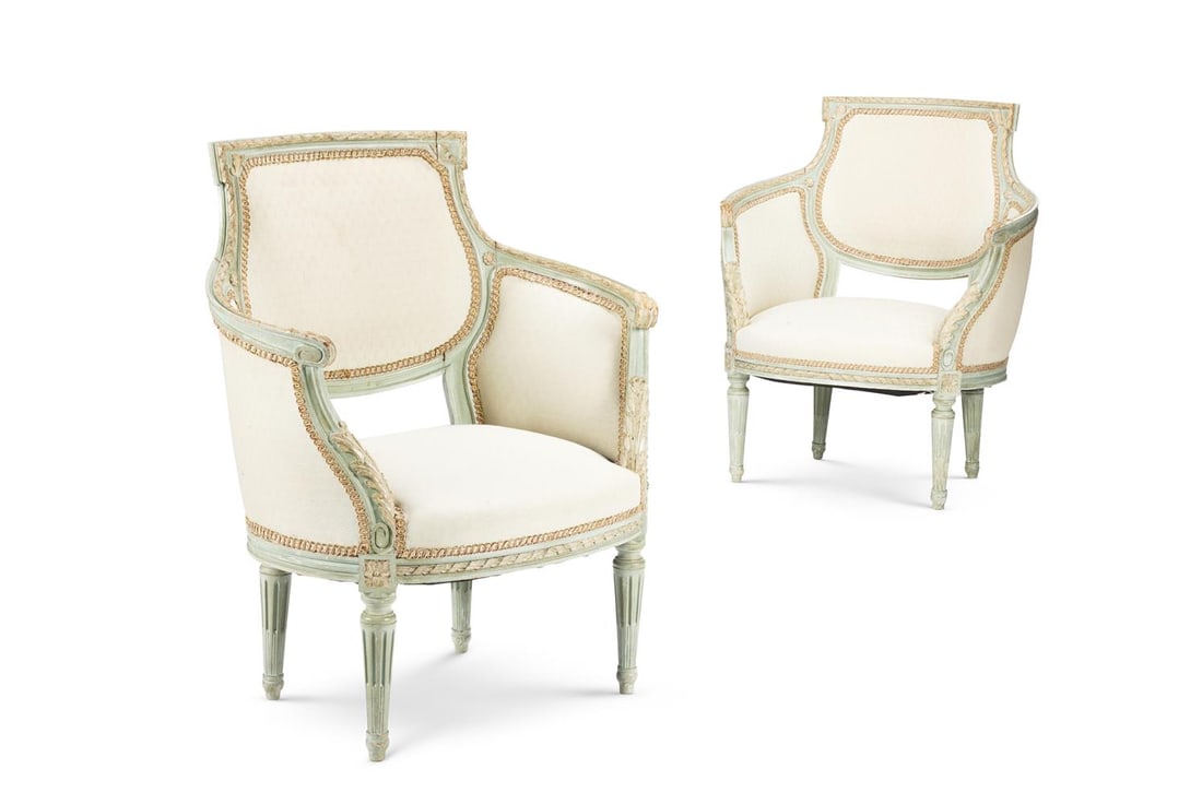 A PAIR OF PALE GREEN AND WHITE PAINTED BERGERES, IN LOUIS XVI STYLE, CIRCA 1900: A PAIR OF PALE GREEN AND WHITE PAINTED BERGERES IN LOUIS XVI STYLE, FRENCH OR NORTH ITALIAN, CIRCA 1900 Each with a foliate and ribbon-carved frame and tapering turned, fluted legs 89cm high, 75cm