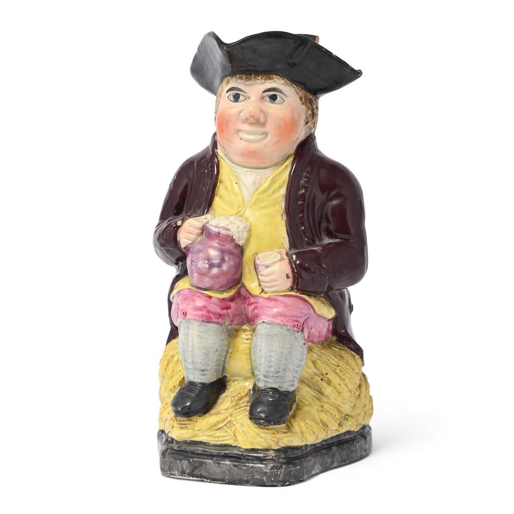 AN ENGLISH PEARLWARE PINK-LUSTRE TOBY JUG, CIRCA 1830: AN ENGLISH PEARLWARE PINK-LUSTRE TOBY JUG CIRCA 1830 Crown mark to base 23.5cm high Condition Report: PLEASE NOTE: ALL LOTS ARE LOCATED AT SACKVILLE WEST STORAGE IN ANDOVER (SP10 3SA) AND ARE NOT