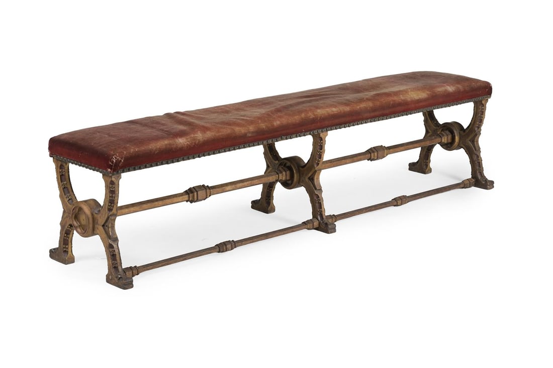 A GOTHIC REVIVAL CARVED, PAINTED, AND PARCEL GILT 'X' FRAME LONG STOOL, SECOND HALF 19TH CENTURY (1 of 4)