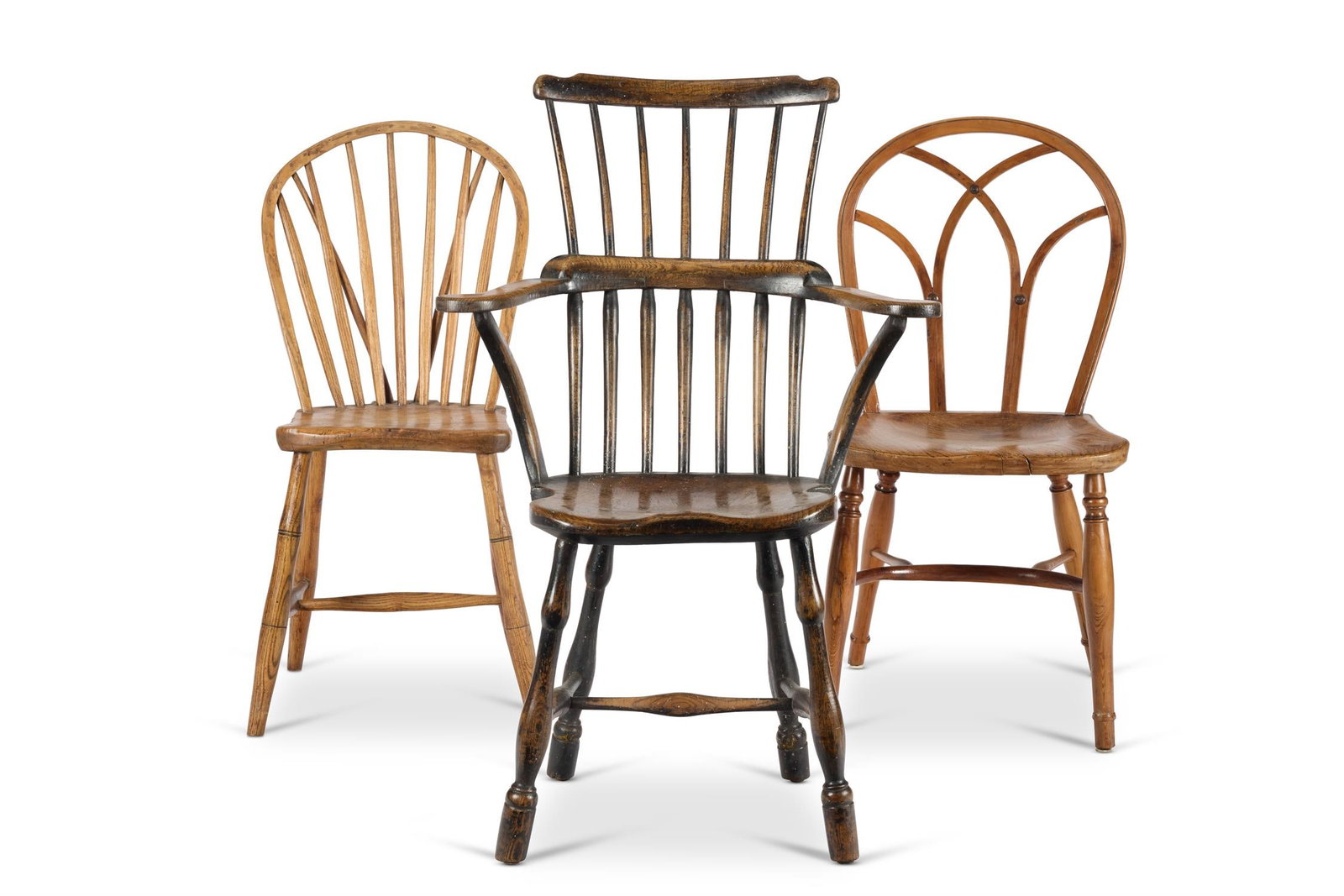 A YEWWOOD, ELM AND ASH GOTHIC WINDSOR CHAIR, 19TH CENTURY: A YEWWOOD, ELM AND ASH GOTHIC WINDSOR CHAIR 19TH CENTURYWith a hoop back, saddle seat and turned legs joined by a crinoline stretcher98cm high, 43cm wide, 46cm deepTogether with another ash and sycamo