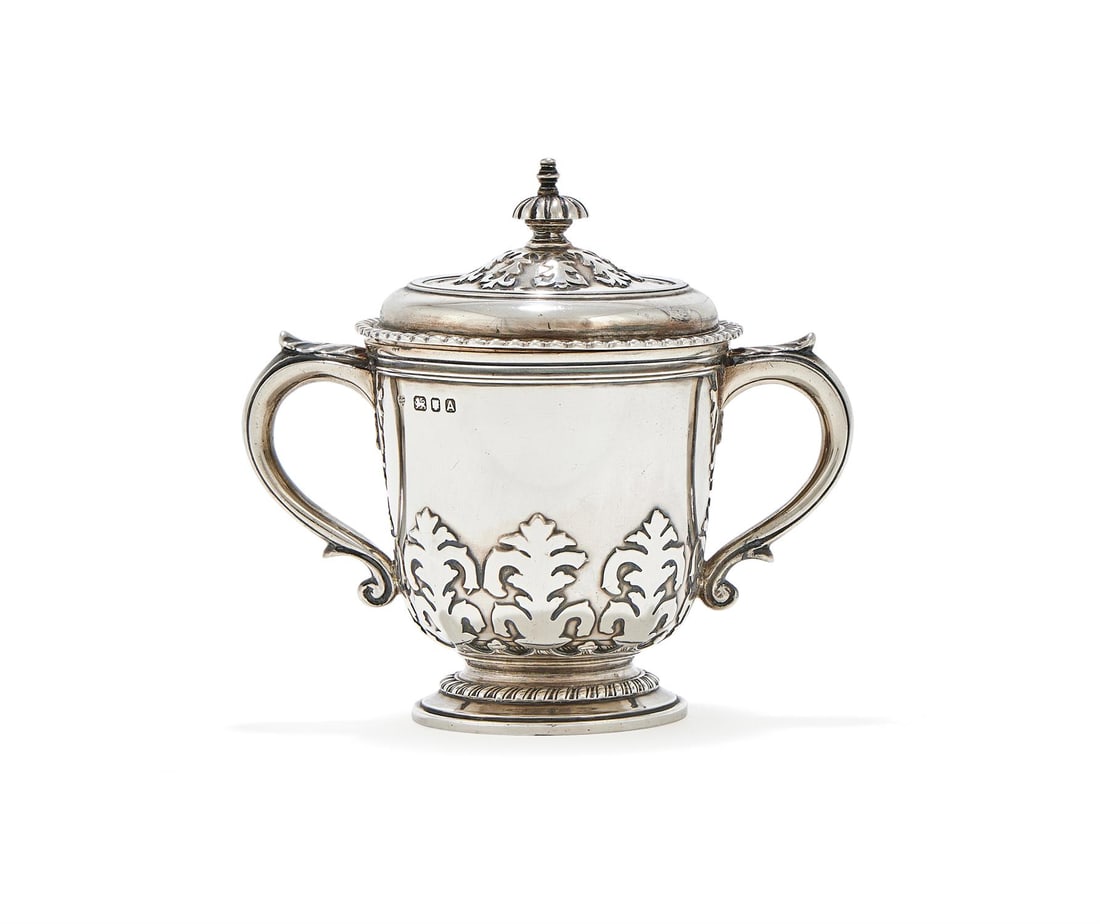 A SILVER TWIN HANDLED CUP AND COVER, GOLDSMITHS & SILVERSMITHS CO. LTD., LONDON 1936 (1 of 3)