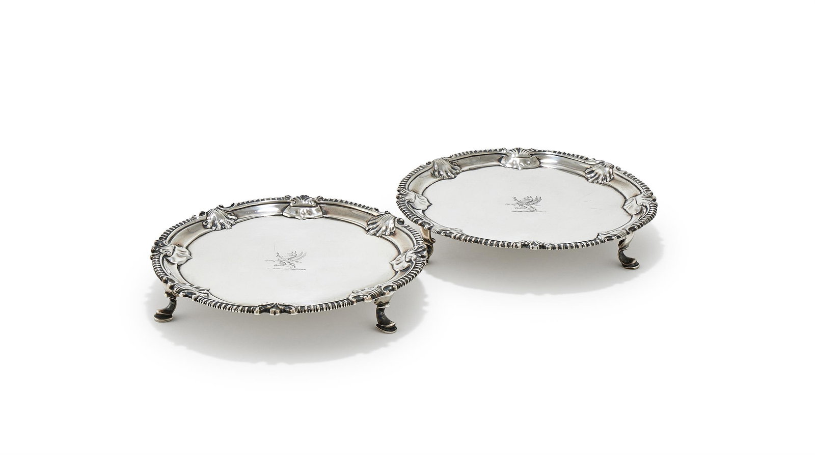 A MATCHED PAIR OF GEORGE III SILVER SHAPED CIRCULAR SALVERS, DAVID BELL, LONDON 1761 AND 1764 (1 of 3)
