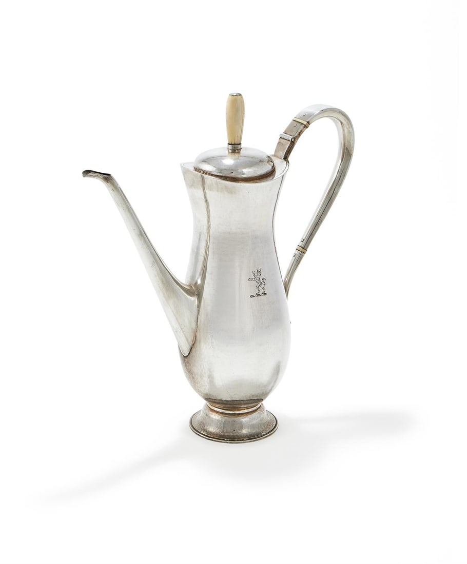 LOT WITHDRAWN: LOT WITHDRAWN - LESLIE GORDON DURBIN, A SILVER BALUSTER COFFEE POTLONDON 1968With an ivory finial to the domed cover, a scroll handle with ivory bands, engraved with a crest and on circular foot31cm h