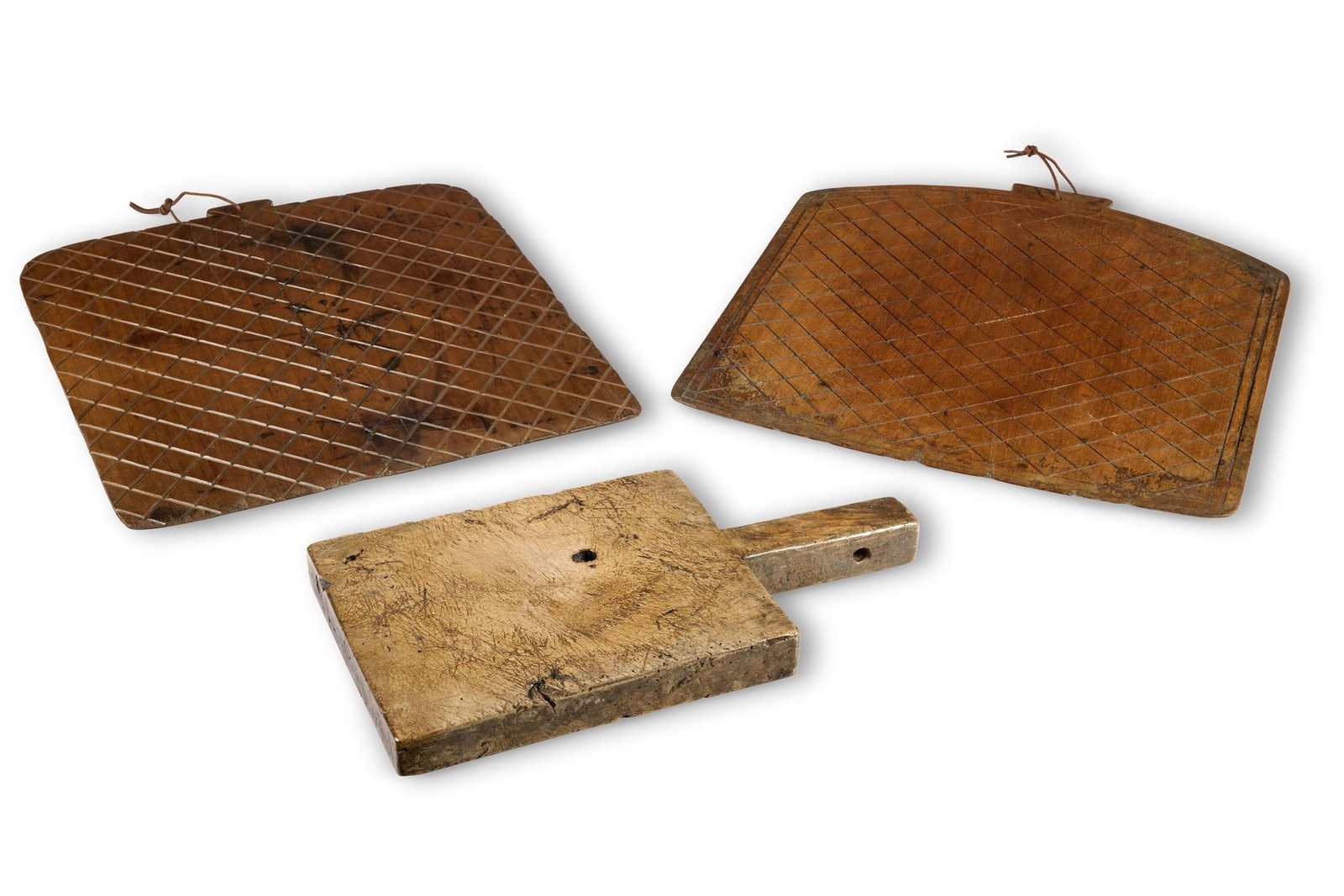 TWO GEORGE III MAHOGANY AND WALNUT RIDDLE BOARDS, LATE 18TH CENTURY: TWO GEORGE III MAHOGANY AND WALNUT RIDDLE BOARDS LATE 18TH CENTURY Each with incised line decoration 53cm and 50cm high Together with a small sycamore chopping board, probably French, 19th century, 18