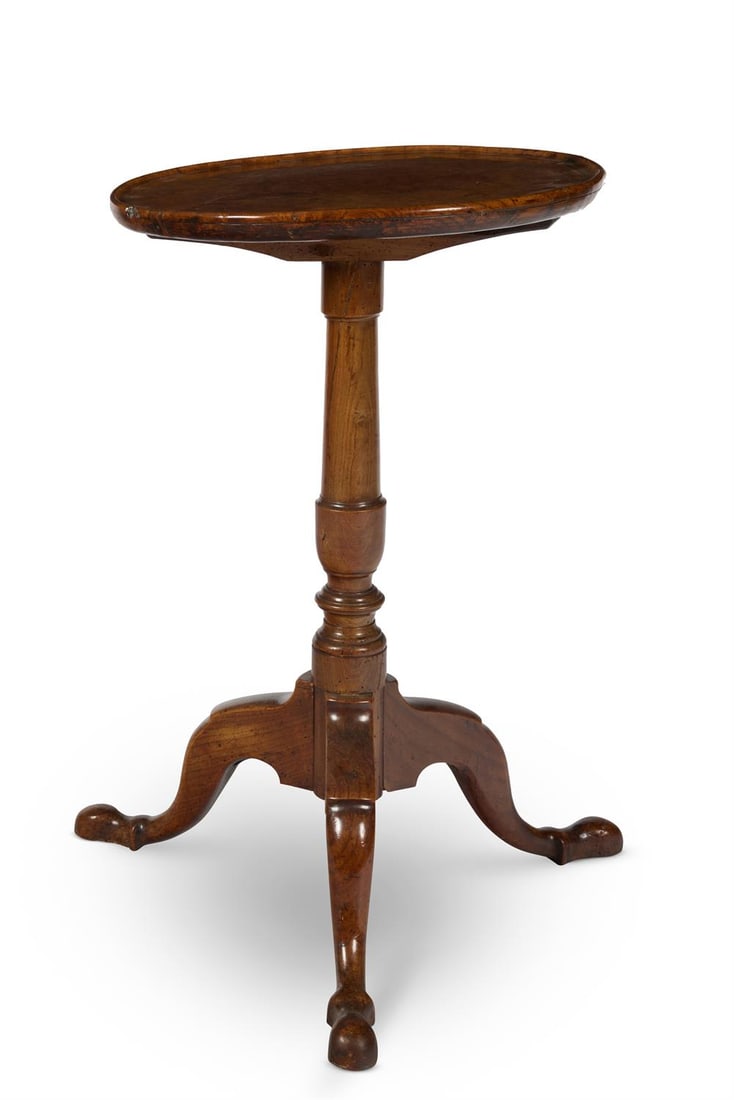 AN ASH AND BURR ELM TRIPOD TABLE, 18TH CENTURY: AN ASH AND BURR ELM TRIPOD TABLE 18TH CENTURYThe circular dished top on a turned pedestal and tripod base with shaped pad feet 75cm high, 43cm diameter