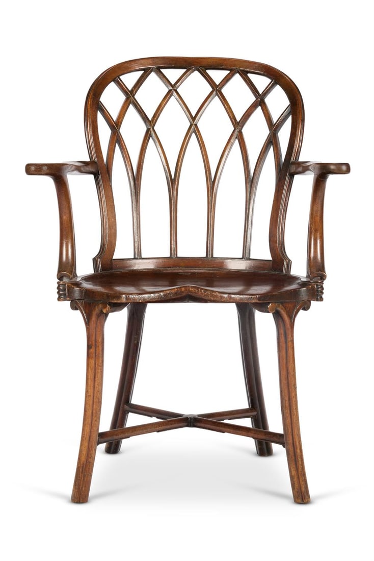 A GEORGE III PROVINCIAL WALNUT AND ELM WINDSOR ARMCHAIR, LATE 18TH CENTURY: A GEORGE III PROVINCIAL WALNUT AND ELM WINDSOR ARMCHAIRLATE 18TH CENTURYThe hooped 'Gothic' tracery back and shaped, scrolled arms above a saddle seat on outswept cluster column legs joined by X-stret