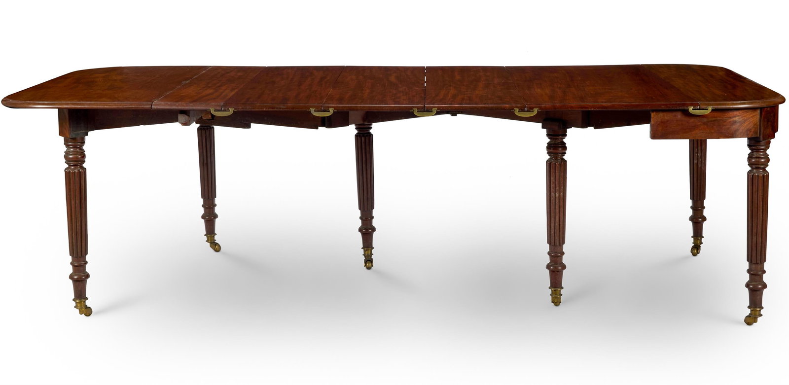 A REGENCY MAHOGANY EXTENDING DINING-TABLE ATTRIBUTED TO WILLIAM WILKINSON, CIRCA 1820 (1 of 1)