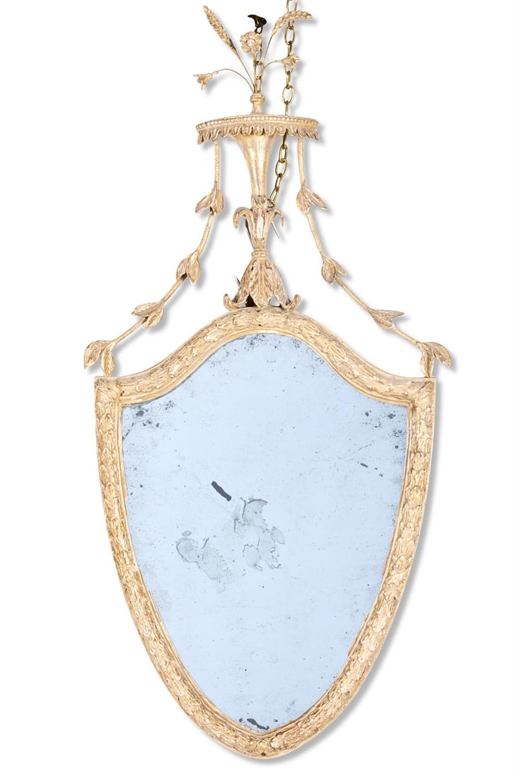 A GEORGE III GILTWOOD SHIELD SHAPED MIRROR, LATE 18TH/EARLY 19TH CENTURY (1 of 2)