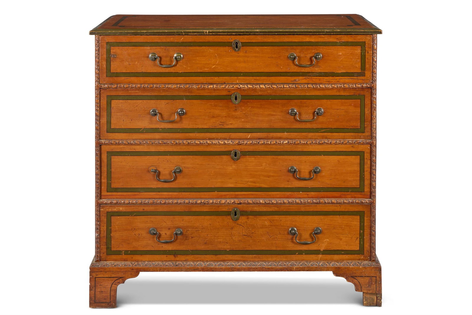 A GEORGE III CYPRESS WOOD AND GREEN-PAINTED CHEST, LATE 18TH CENTURY: A GEORGE III CYPRESS WOOD AND GREEN-PAINTED CHESTLATE 18TH CENTURYOf four graduated long drawers, the drawer divisions and plinth with ribbon-and-rosette carving, on bracket feet103cm high, 107cm wide