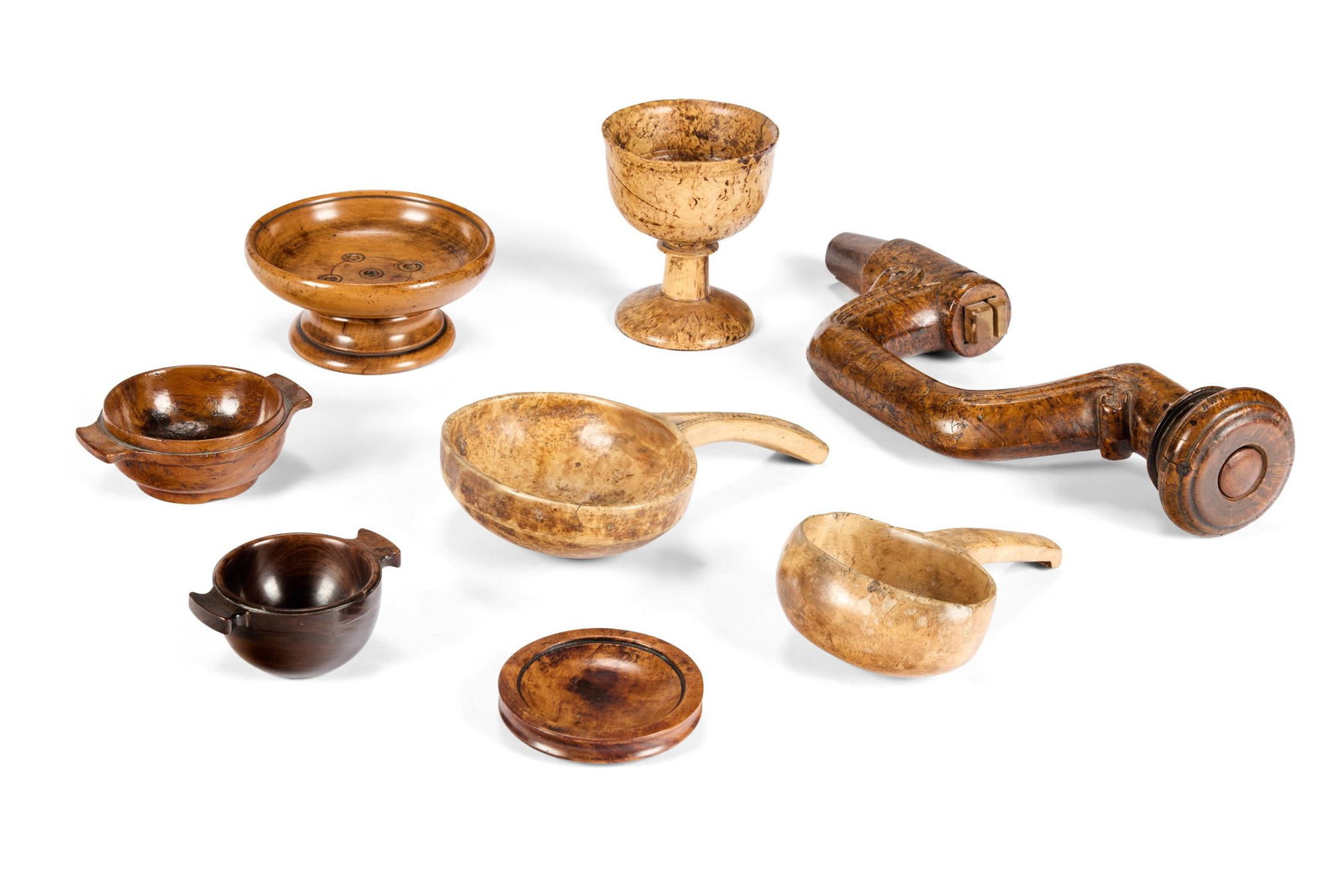 A COLLECTION OF EIGHT TREEN OBJECTS MOSTLY 19TH CENTURY Comprising two Scandinavian 'Kasa' drinkin (1 of 2)