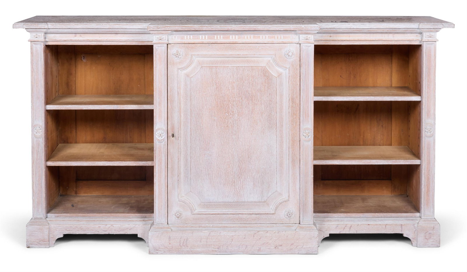 A MID VICTORIAN LIMED OAK BREAKFRONT CABINET BY L.W.COLLMANN, CIRCA 1875 (1 of 2)