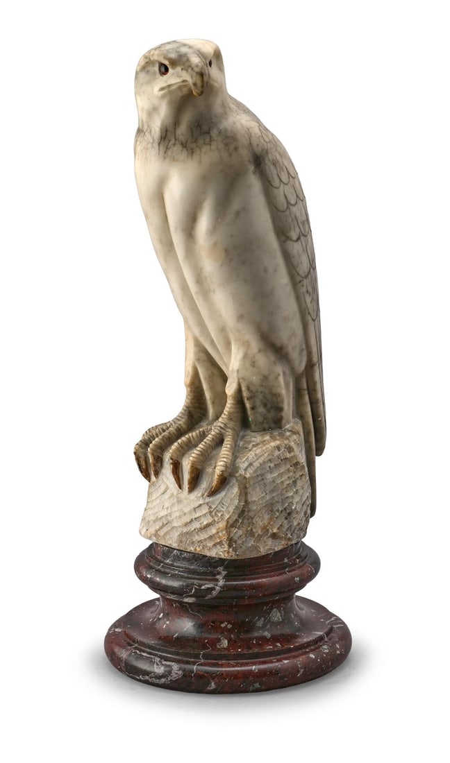 A MARBLE FIGURE OF A FALCON, 20TH CENTURY: A MARBLE FIGURE OF A FALCON 20TH CENTURY On a rouge granite socle 57cm high overall Provenance: Acquired from L'Encoignure, London, 25th October 1999