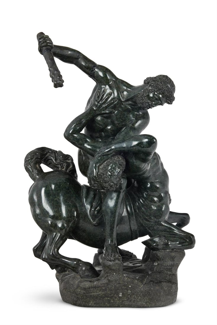 AFTER GIAMBOLOGNA, A CARVED GREEN SERPENTINE GROUP, 'HERCULES AND THE CENTAUR NESSUS', ITALIAN: AFTER GIAMBOLOGNA- A CARVED GREEN SERPENTINE GROUP 'HERCULES AND THE CENTAUR NESSUS' ITALIAN, EARLY/MID 19TH CENTURY 44cm high, 33cm wide The original Hercules and Nessus group by Giambologna was comm