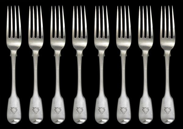 A set of eight George IV fiddle pattern forks by S: A set of eight George IV fiddle pattern forks by Sarah & John William Blake, London 1822, engraved with a crest, 20.5cm (8in) long, 547g (17.6 oz) The crest of MUSGRAVE of Cumberland.