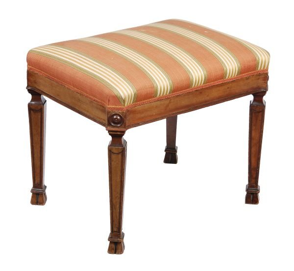 A George III mahogany stool, in the manner of Thom: A George III mahogany stool, in the manner of Thomas Chippendale, circa 1800, of Royal Interest, rectangular top, upholstered seat, canted stool centred by roundels, serpentine frieze, square section