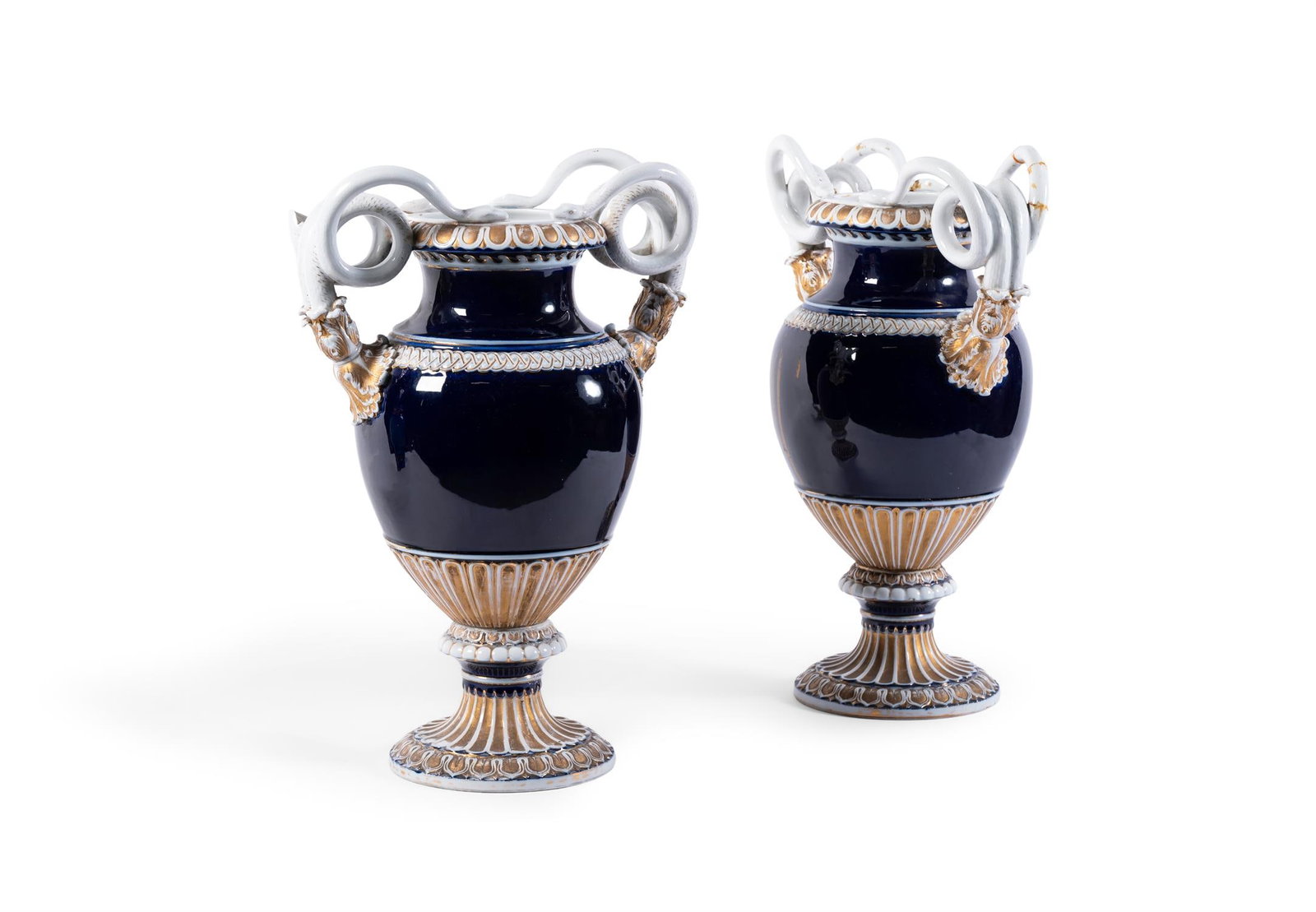 A PAIR OF MEISSEN BLUE GROUND AND GILT SERPENT HANDLED VASES, LATE 19TH CENTURY: A PAIR OF MEISSEN BLUE GROUND AND GILT SERPENT HANDLED VASESLATE 19TH CENTURY Blue crossed swords marks47cm high