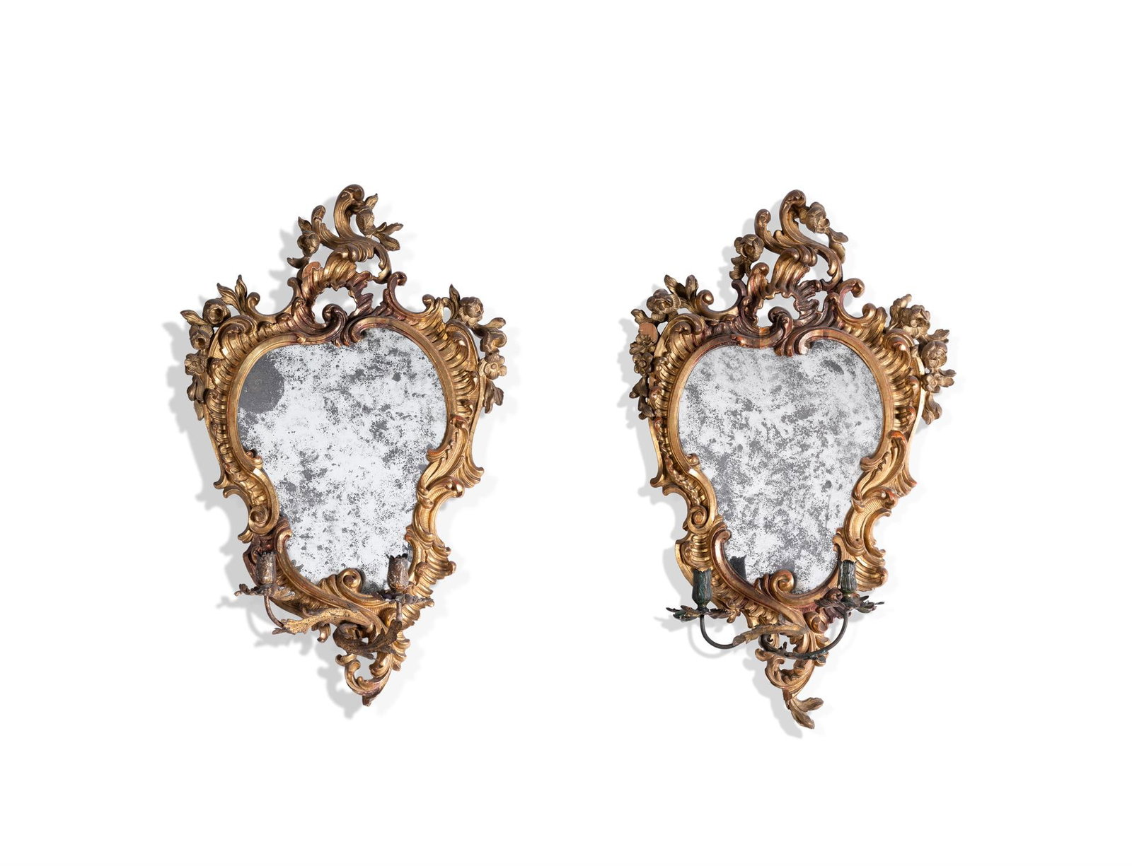A PAIR OF CARVED GILTWOOD GIRANDOLES, ITALIAN, OF ROCOCO STYLE, 19TH CENTURY: A PAIR OF CARVED GILTWOOD GIRANDOLESITALIAN, OF ROCOCO STYLE, 19TH CENTURYEach with a cartouche shaped plate within a surround of scrolling foliage and flowers, issuing two scrolling candle branches w