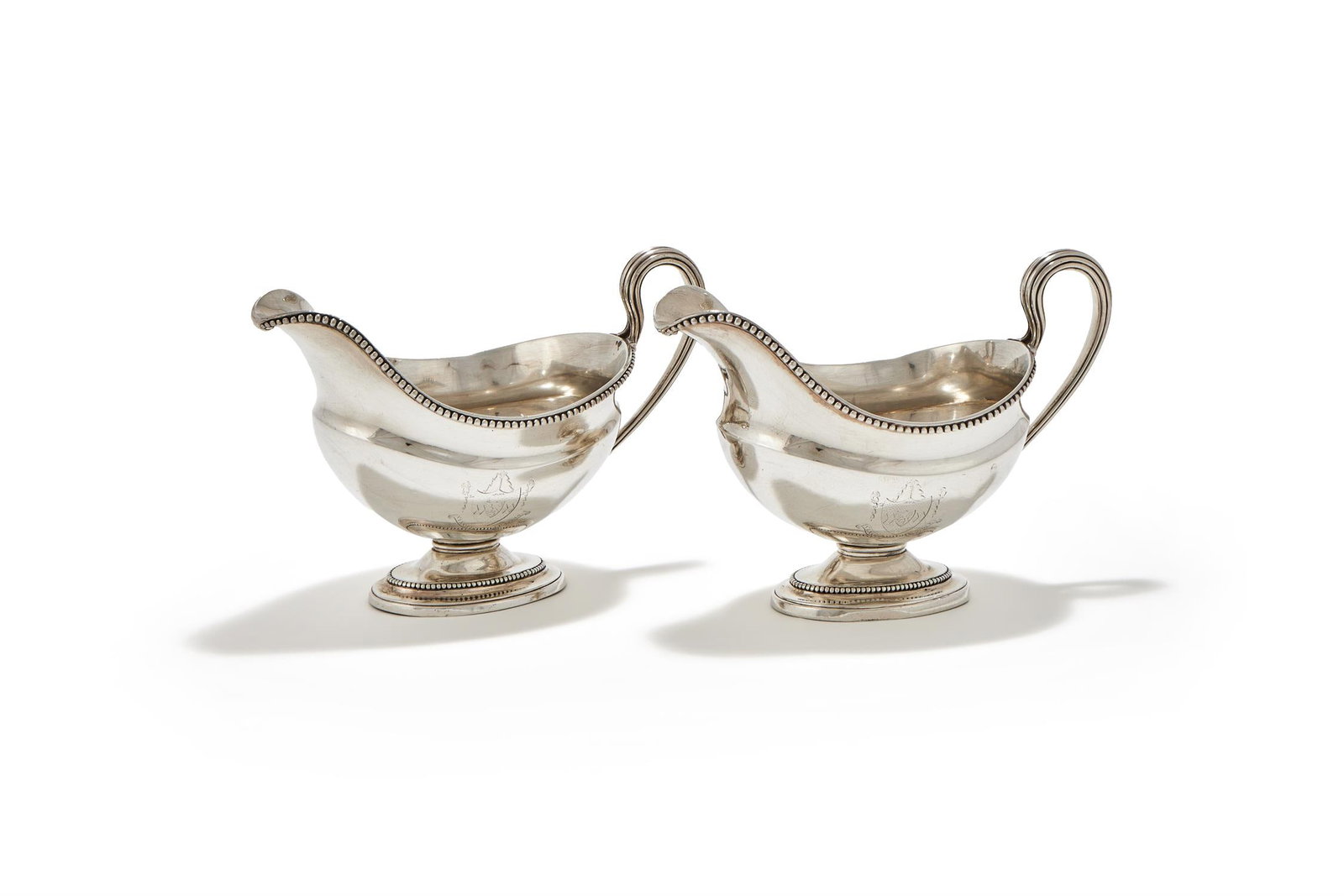 A PAIR OF GEORGE III SILVER OVAL SAUCEBOATS, DANIEL SMITH & ROBERT SHARP, LONDON 1774 AND 1778 (1 of 3)