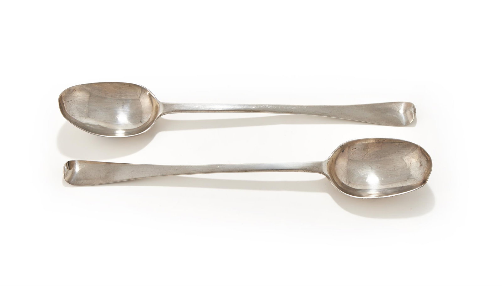 A PAIR OF QUEEN ANNE SILVER HANOVERIAN PATTERN BASTING SPOONS, DAVID WILLAUME (1 of 2)
