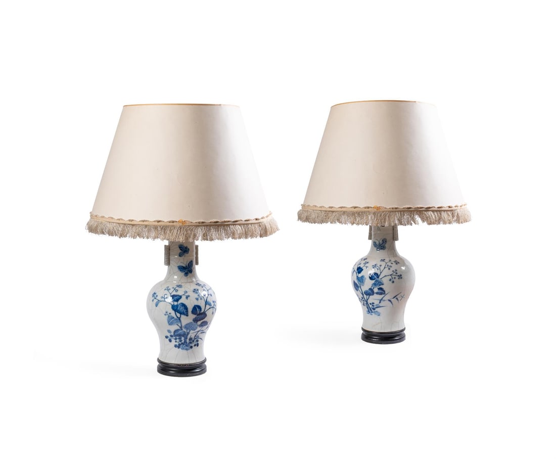 A PAIR OF CHINESE BLUE AND WHITE CRACKLE GLAZED BALUSTER VASES, 19TH CENTURY: A PAIR OF CHINESE BLUE AND WHITE CRACKLE GLAZED BALUSTER VASES19TH CENTURY Decorated with flowers and insectsthe vases 42cm high, 83cm high overall including fittings and shadeslater adapted for elect