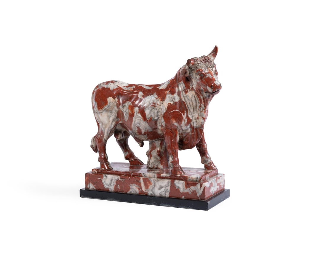 AFTER THE ANTIQUE- A PAVONAZZETTO MARBLE FIGURE OF A BULL, ROMAN: AFTER THE ANTIQUE- A PAVONAZZETTO MARBLE FIGURE OF A BULL ROMAN, LATE 18TH OR EARLY 19TH CENTURY Set on black marble plinth base overall 43cm high, base 39cm wide Literature: N. Penny, Catalogue of Eu