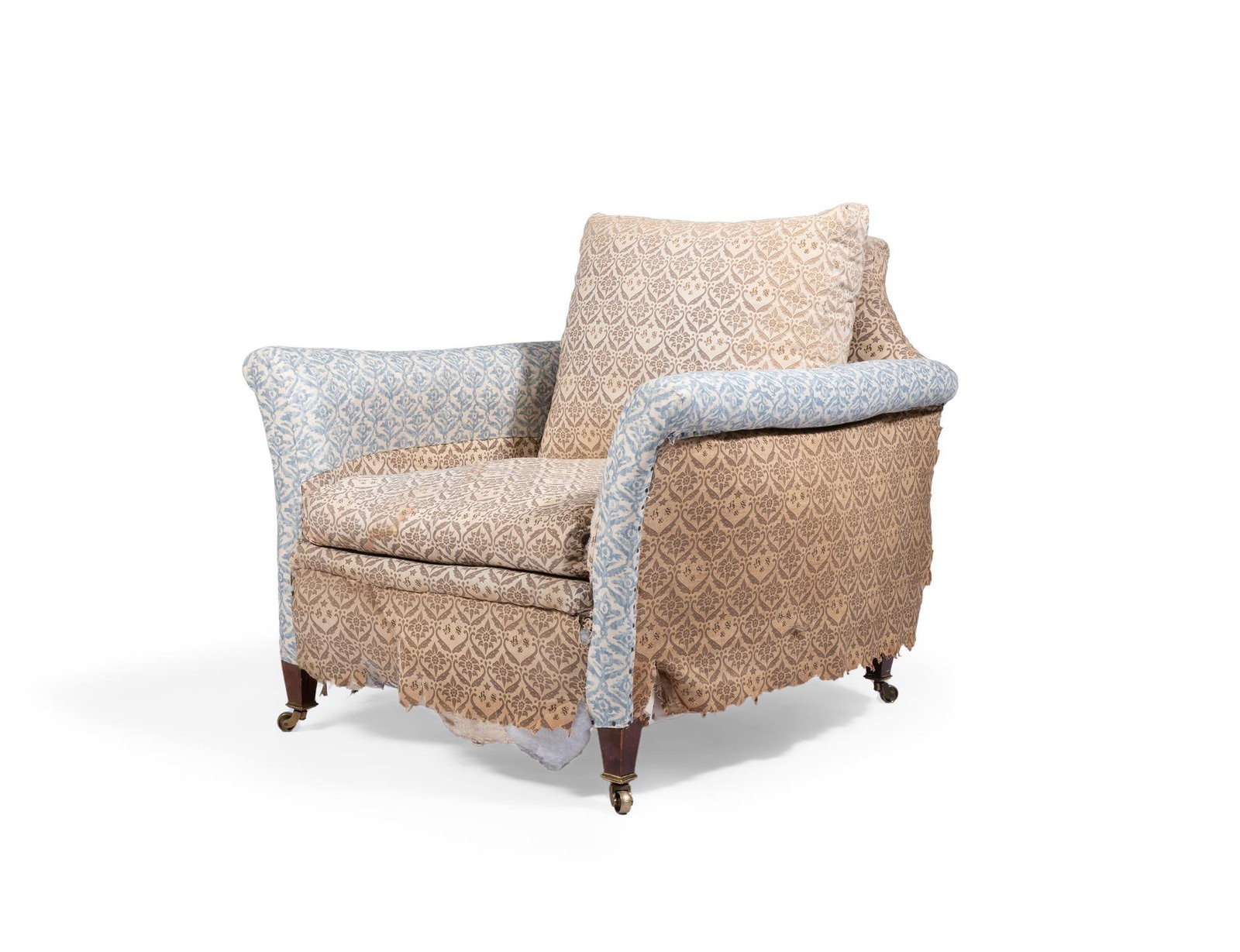 AN EDWARDIAN HOWARD & SONS ARMCHAIR, EARLY 20TH CENTURY: AN EDWARDIAN HOWARD & SONS ARMCHAIREARLY 20TH CENTURY Partly covered in H&S monogram fabric on short square tapering legs with brass castors, stamped 17988 9590 HOWARD & SONS LTD BERNERS ST, castors s