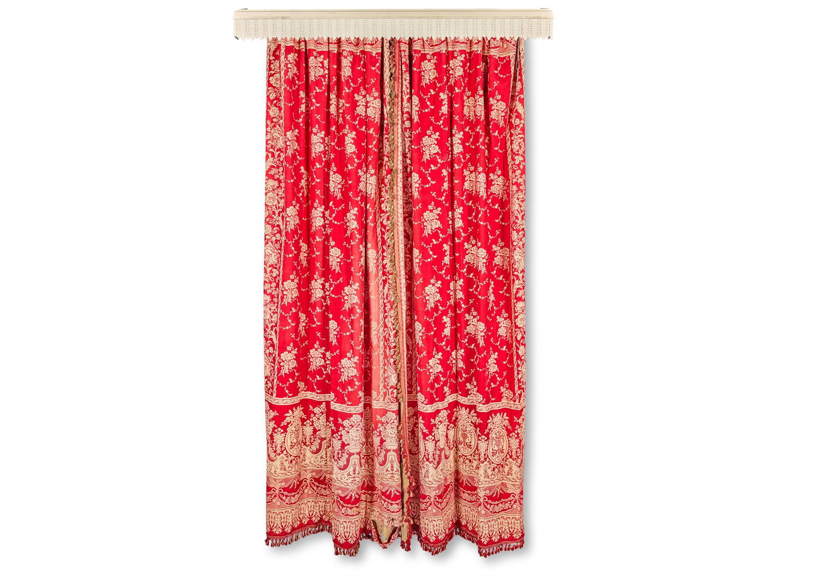 A PAIR OF RED FLORAL PATTERN CURTAINS: A PAIR OF RED FLORAL PATTERN CURTAINS 305cm drop approximatelyTogether with a white painted pelmet, 75.5cm wide