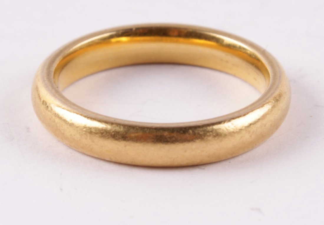 A 22 carat gold wedding ring, Birmingham 1964, of