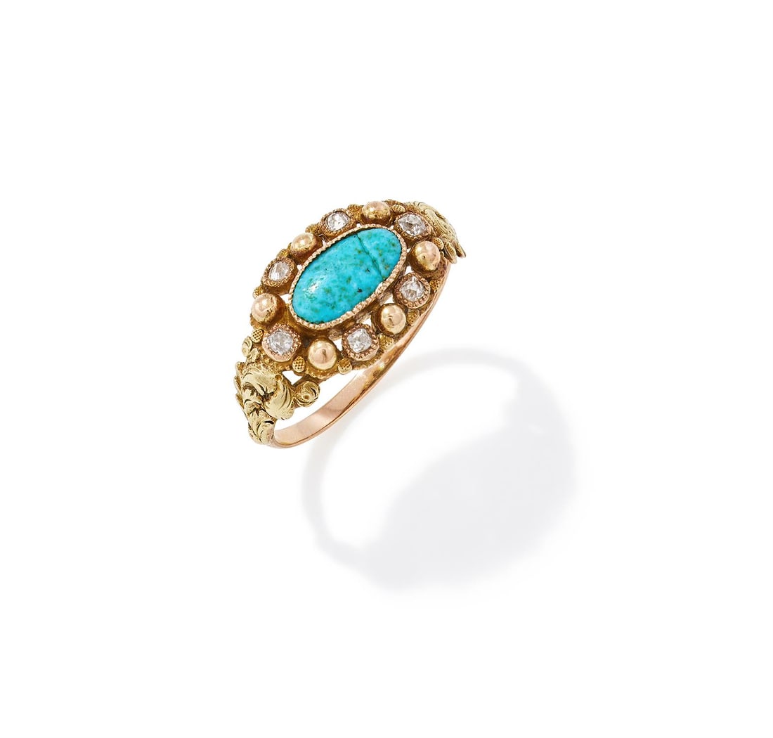 A TURQUOISE AND DIAMOND CLUSTER RING: A TURQUOISE AND DIAMOND CLUSTER RING FIRST HALF OF THE 19TH CENTURY AND LATER The central oval turquoise panel (fractured) within a gold beaded and old mine cut diamond surround, hinged glazed compart