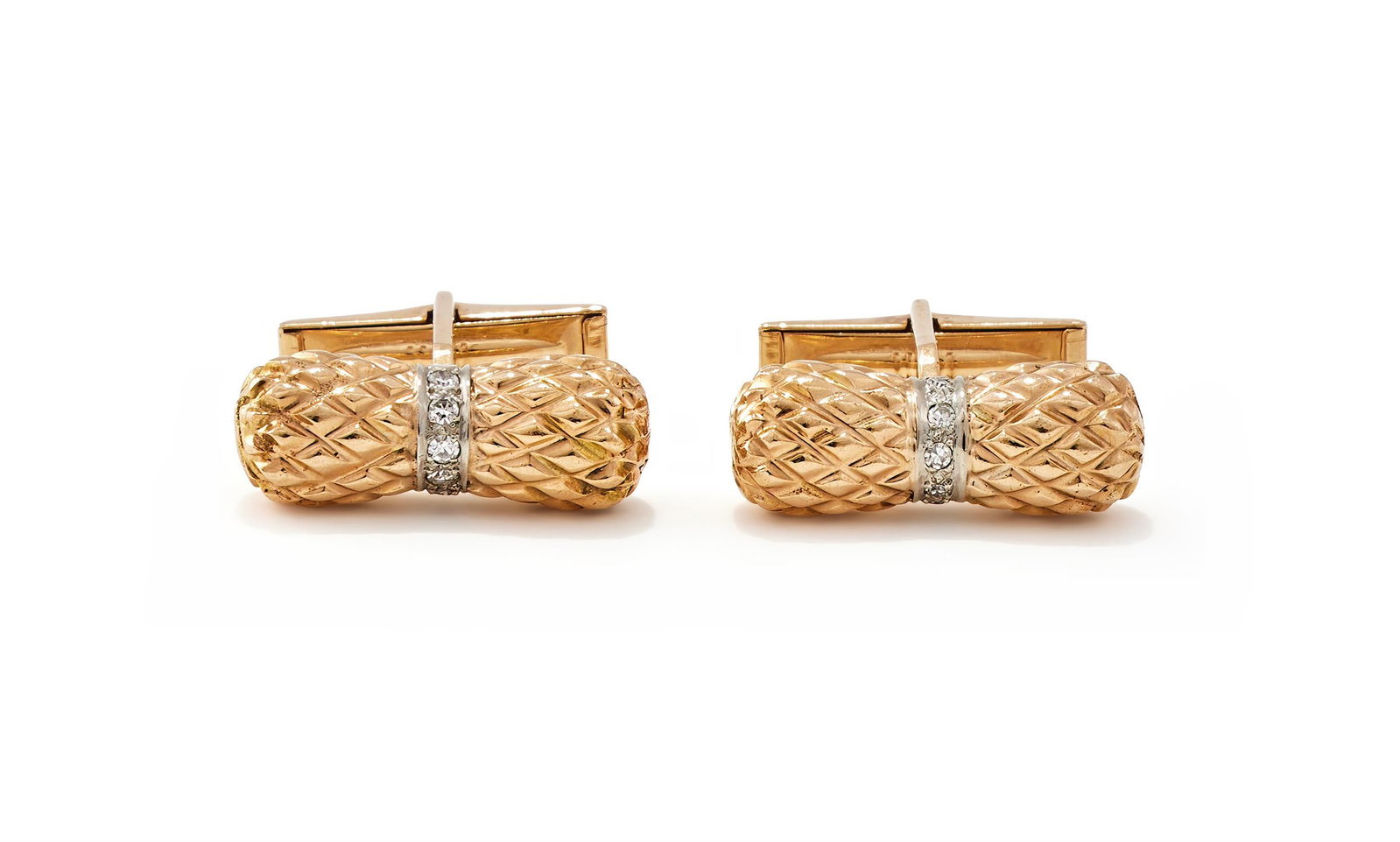 A PAIR OF DIAMOND SET CUFFLINKS: A PAIR OF DIAMOND SET CUFFLINKS The textured batons with a central band of single cut diamonds, swivel fittings, stamped 14KSize/dimensions: 2.3cm wideGross weight: 18.5 grams