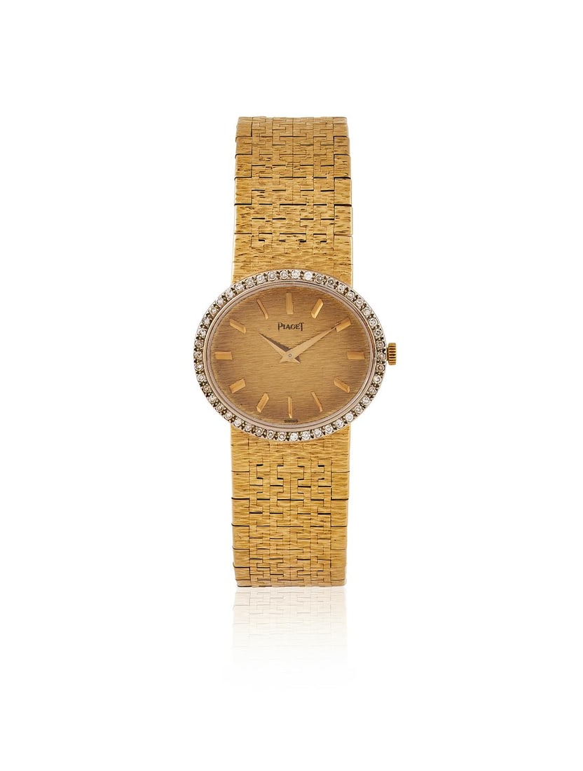 PIAGET, A DIAMOND SET WRISTWATCH: PIAGET, A DIAMOND SET WRISTWATCHThe textured oval dial with baton markers within a single cut diamond bezel, case back secured by two screws, integral textured Piaget bracelet, signed Piaget, case bac