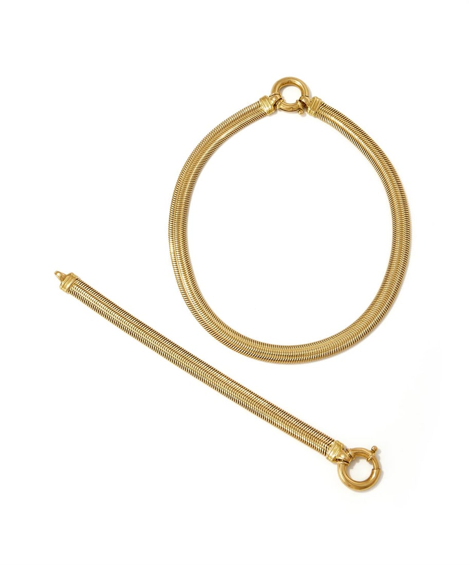 A FANCY LINK NECKLACE AND BRACELET: A FANCY LINK NECKLACE AND BRACELETEach of flattened gaspipe linking with a bolt ring clasp, stamped 750Size/dimensions: necklace 42.5cm, bracelet 20.0cm longGross weight: 128.4 grams