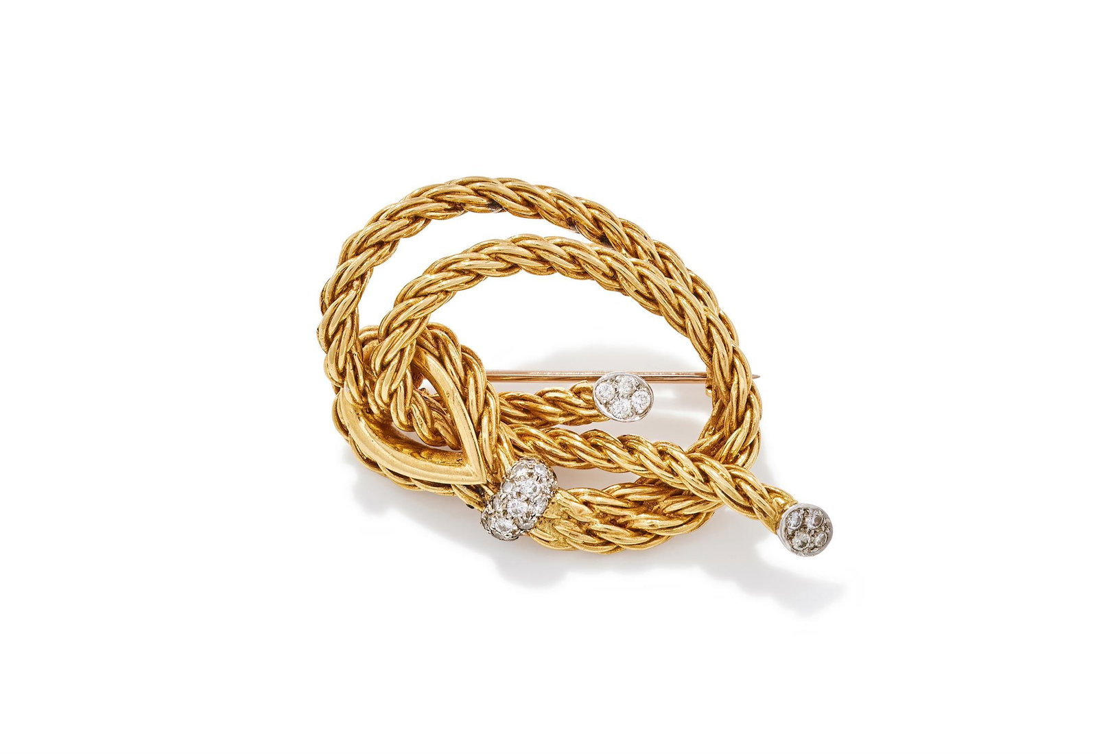 KUTCHINSKY, A DIAMOND SET BROOCH: KUTCHINSKY, A DIAMOND SET BROOCHLONDON, 1970Designed as a coiled 18ct gold rope and eyelet with thimble, with pavé set brilliant cut diamond terminals and accent, signed Kutchinsky, UK hallmark,