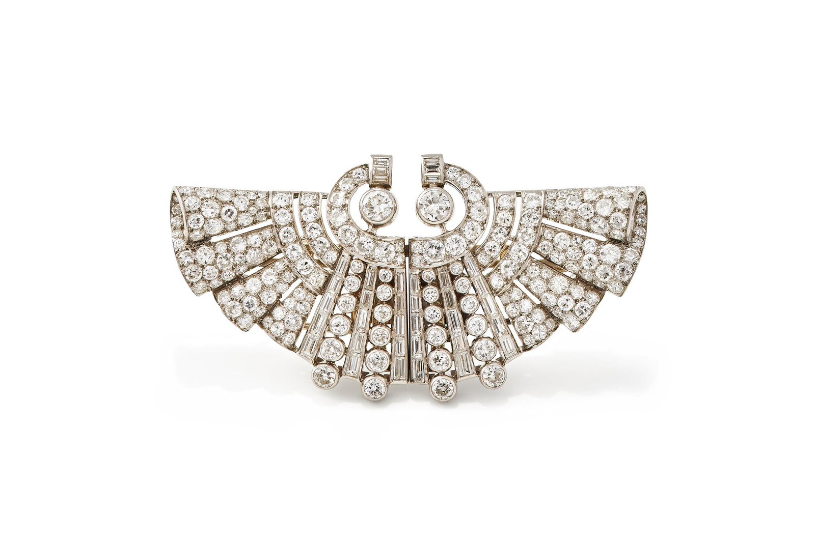 A FRENCH ART DECO DIAMOND DOUBLE-CLIP BROOCH: A FRENCH ART DECO DIAMOND DOUBLE-CLIP BROOCHCIRCA 1930Of fan shaped design, with pavé set old European and single cut diamond scrolls and lines of baguette and collet set old cut diamonds, maker's ma