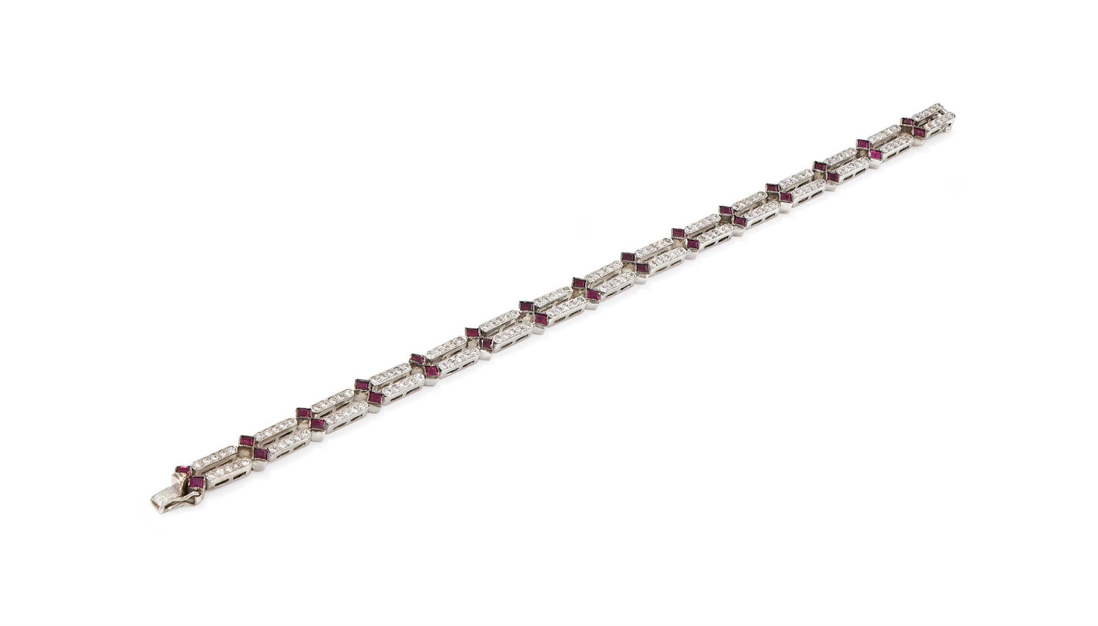 A RUBY AND DIAMOND BRACELET: A RUBY AND DIAMOND BRACELETComposed of two lines set with alternating brilliant cut diamond sections and square cut ruby single stones, stamped 750Size/dimensions: 18.5cm longGross weight: 16.2 grams