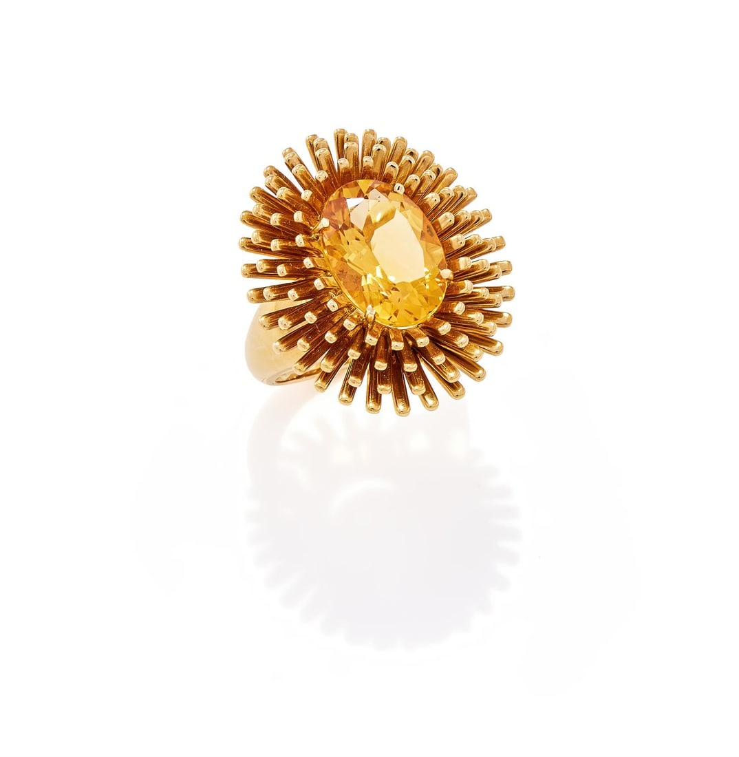 A CITRINE DRESS RING: A CITRINE DRESS RING LONDON 2017The oval cut citrine within a radiating 18ct gold surround, UK hallmarkSize/dimensions: ring size Q Gross weight: 15.8 grams