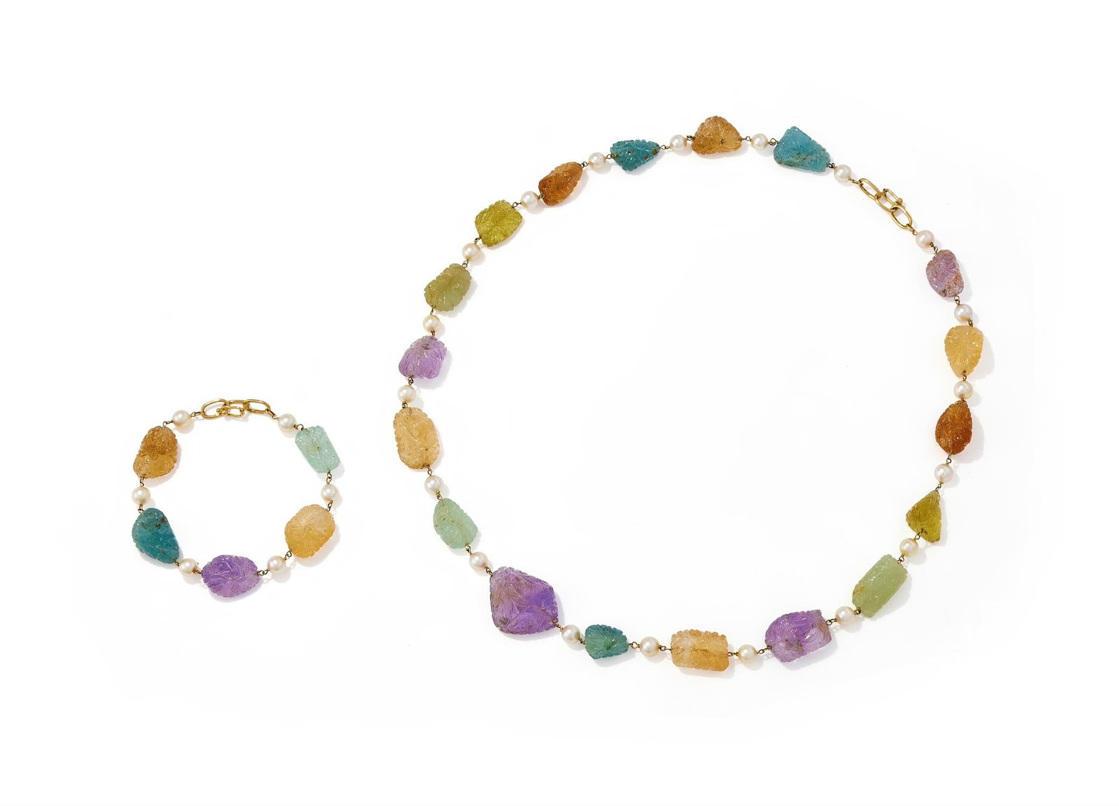 A CARVED GEM AND CULTURED PEARL NECKLACE AND BRACELET: A CARVED GEM AND CULTURED PEARL NECKLACE AND BRACELETThe shaped citrine, amethyst, aquamarine and prehnite carved with flowers and foliage, the looped clasps stamped 18KSize/dimensions: 68cm long, bra