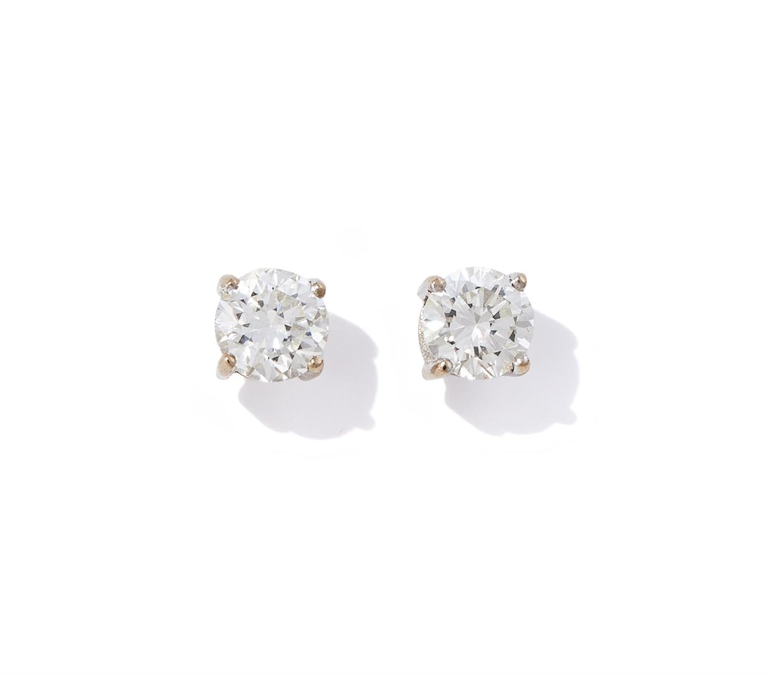 A PAIR OF DIAMOND SINGLE STONE EARRINGS (1 of 2)