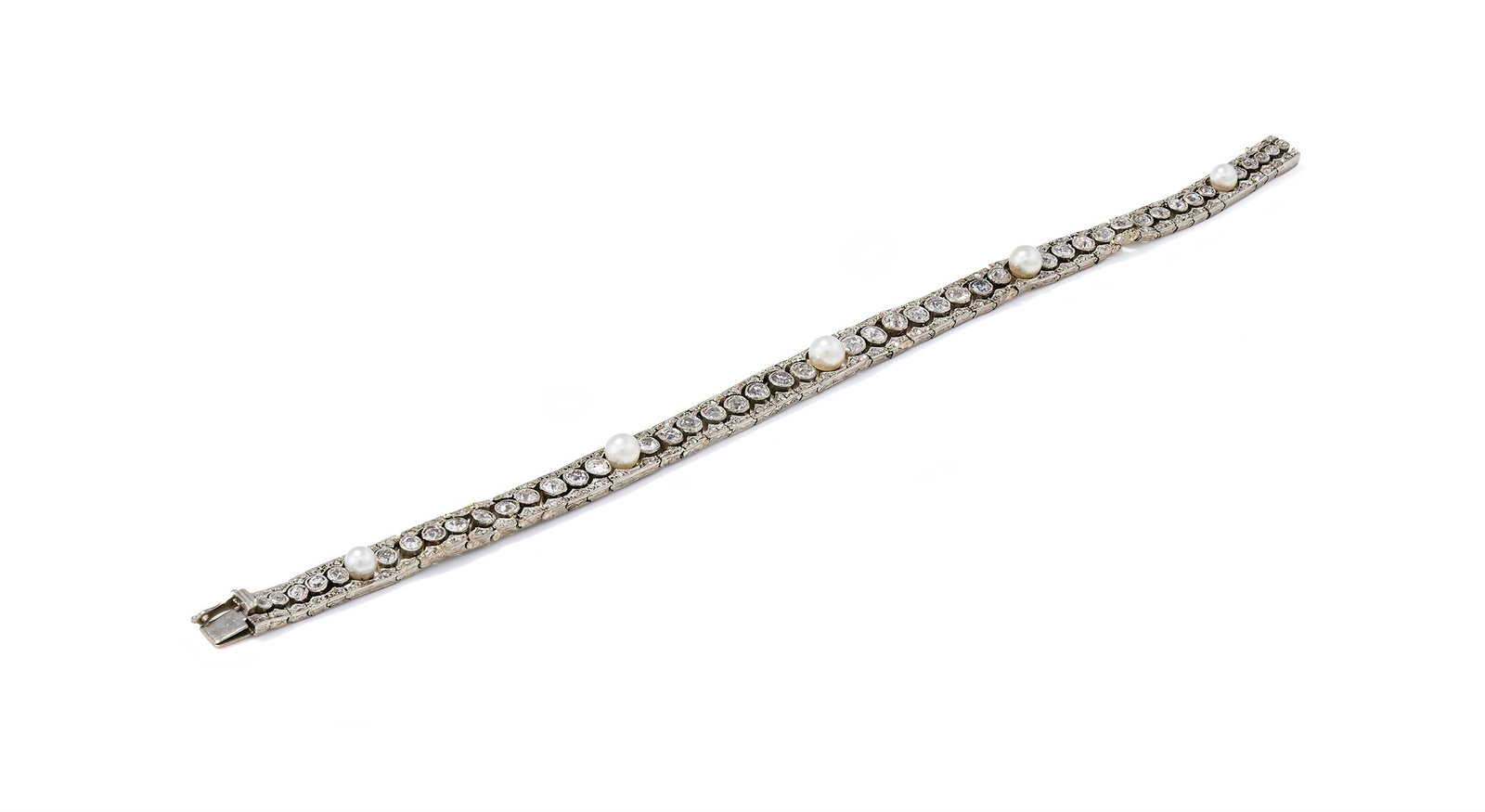 AN EARLY 20TH CENTURY PEARL AND DIAMOND BRACELET: AN EARLY 20TH CENTURY PEARL AND DIAMOND BRACELETDesigned as a graduated line of millegrain set old European cut diamonds interspersed with five 4.07-5.04mm pearls between pierced, rose cut diamond set