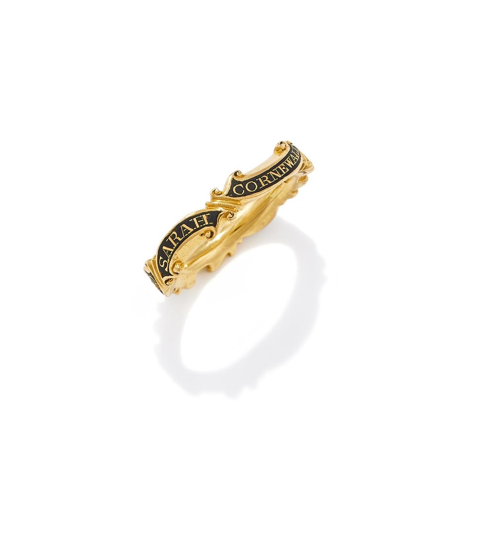 A MID 18TH CENTURY ENAMEL MOURNING RING: A MID 18TH CENTURY ENAMEL MOURNING RINGThe scrolled band reading 'Sarah Cornewall OB 2 Mar 1750, AE 70', mounted in gold, maker's mark CDSize/dimensions: ring size KGross weight: 5.3 grams
