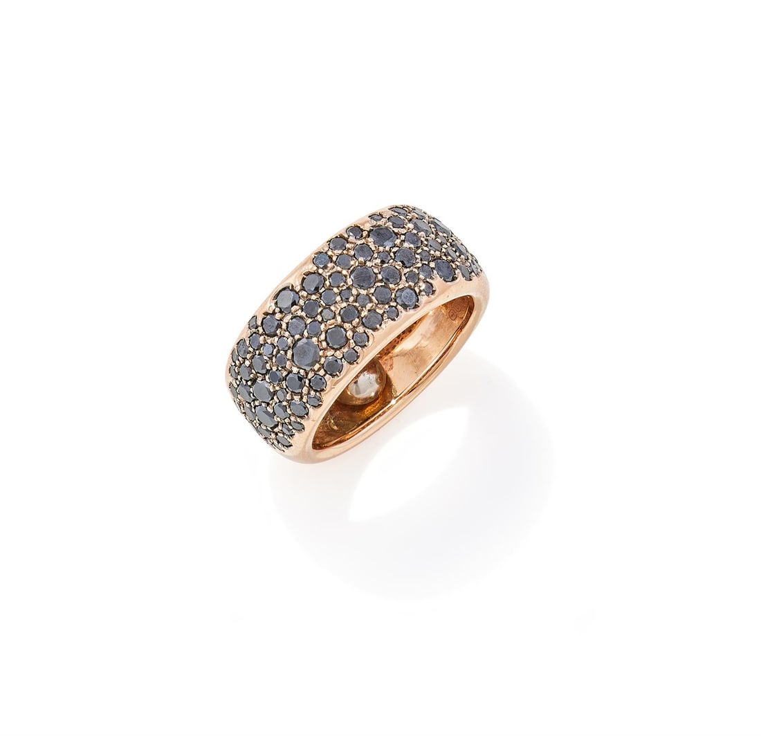 A BLACK DIAMOND BAND RING: A BLACK DIAMOND BAND RING The broad 18ct rose gold band pavé set with graduated circular cut black diamonds, partial Birmingham hallmark, sponsor's mark SF, Italian control marksSize/dimensions: