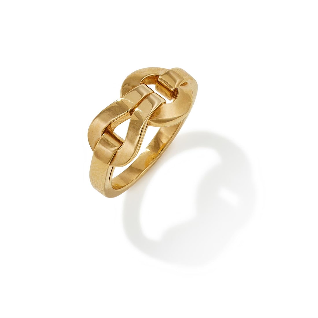 CARTIER, AN 18CT GOLD 'AGRAFE' RING: CARTIER, AN 18CT GOLD 'AGRAFE' RING Of loop and buckle design, to a polished band, signed Cartier, numbered GK1864, Swiss and common control marks, French poinçon and maker's mark, with red