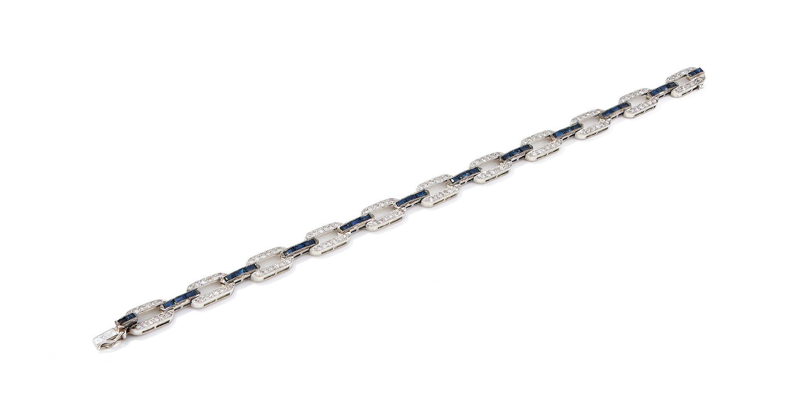 A SAPPHIRE AND DIAMOND BRACELET: A SAPPHIRE AND DIAMOND BRACELETComposed of oval openwork single cut diamond links, between calibré cut sapphire connectors, stamped 750Size/dimensions: 17.4cm longGross weight: 11.8 grams
